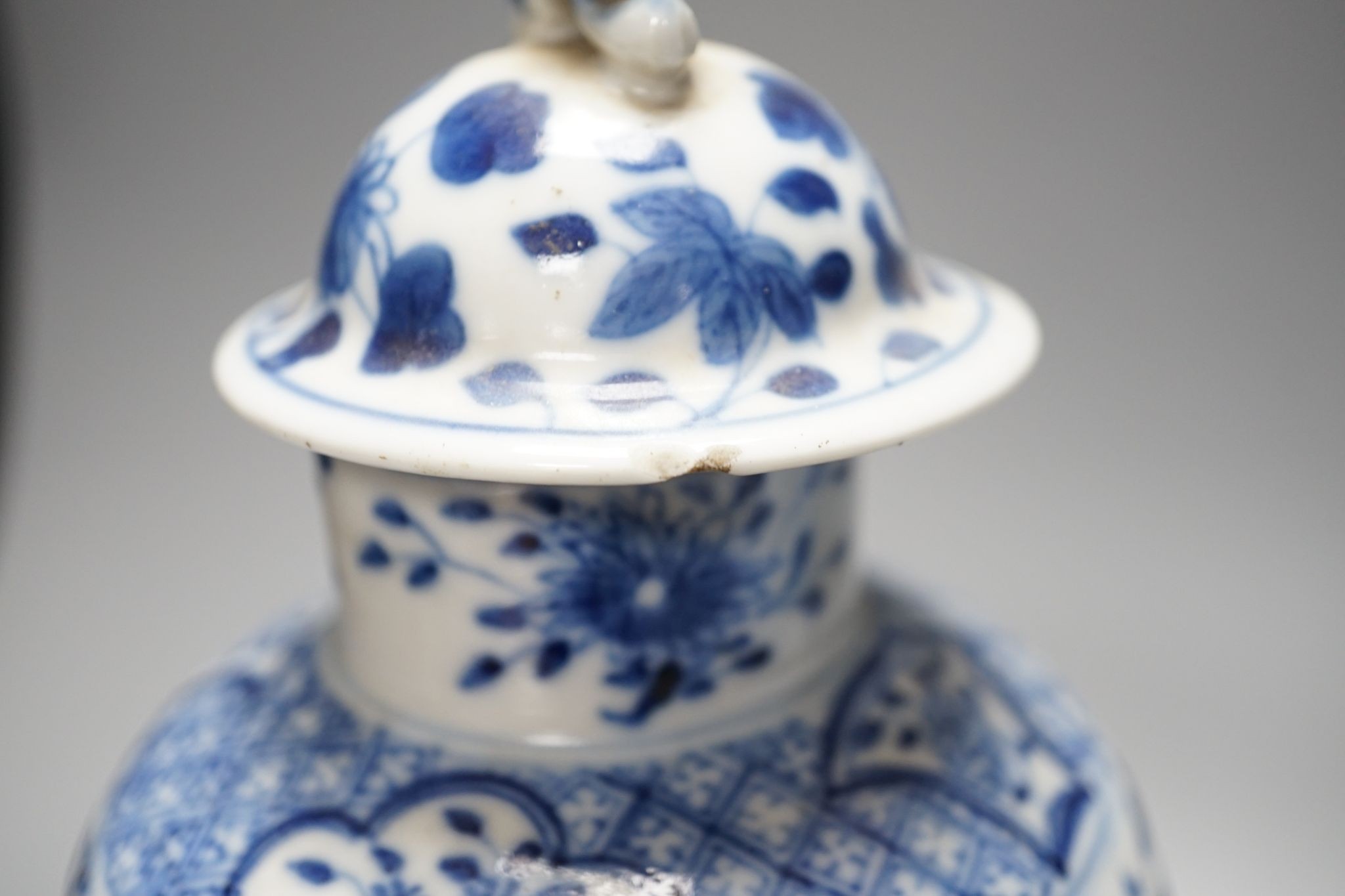 A pair of Chinese blue and white dragon vases and covers, circa 1900. 28cm